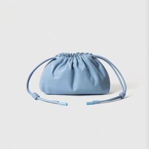 Mini leather pouf bag clutch in sky blue